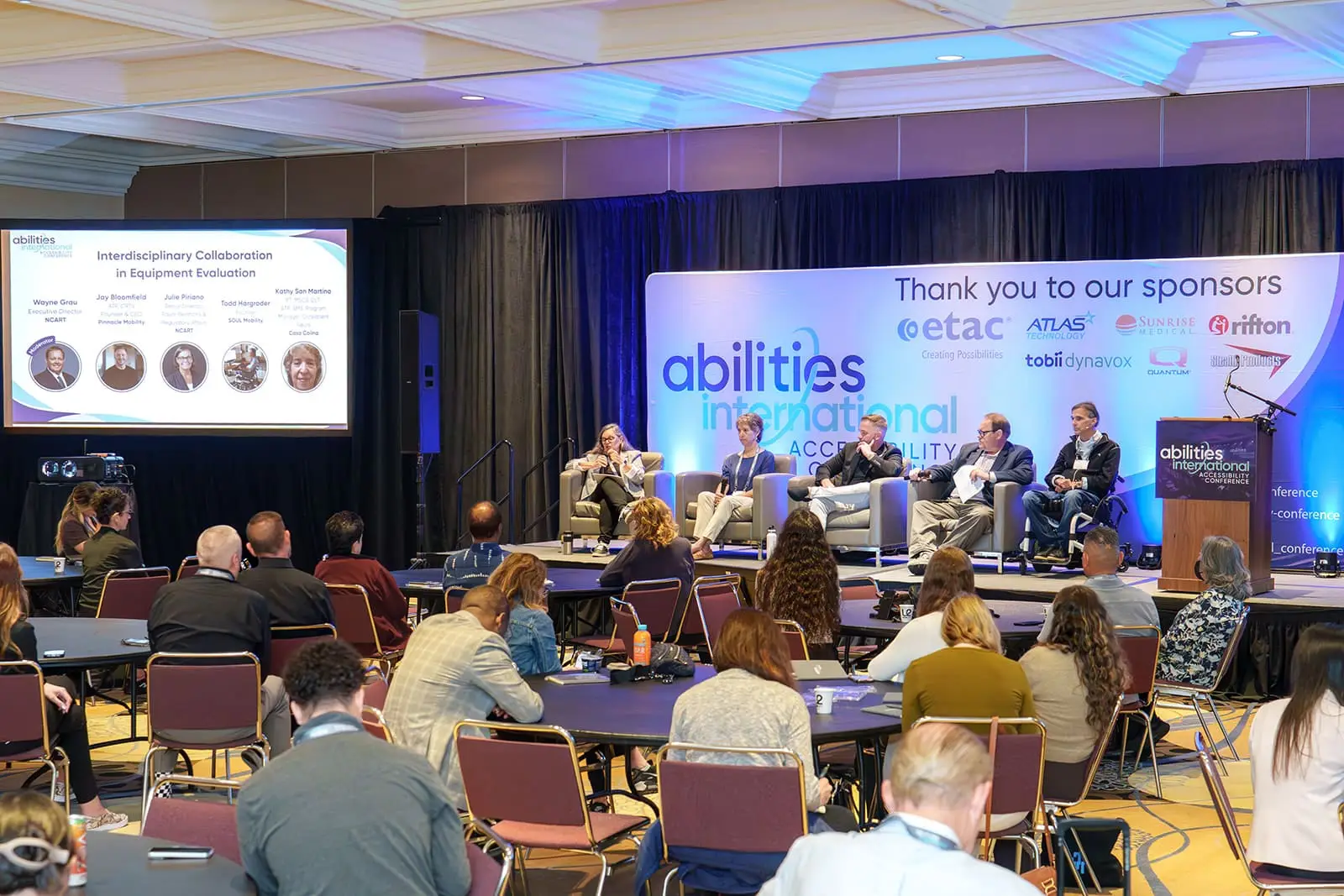 A rapt audience listens to a panel discussion at Abilities International Accessibility Conference